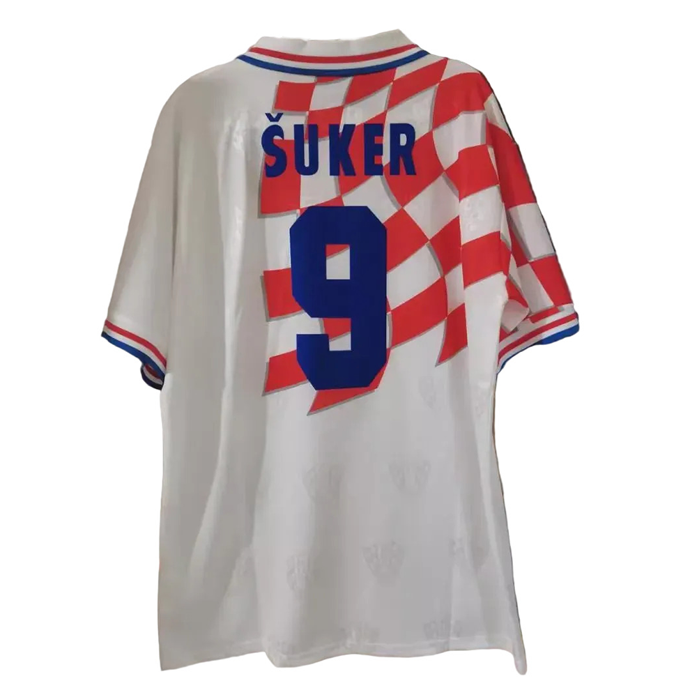 White sports jersey with red and blue patterns, featuring the name 'Suker' and number '9'.