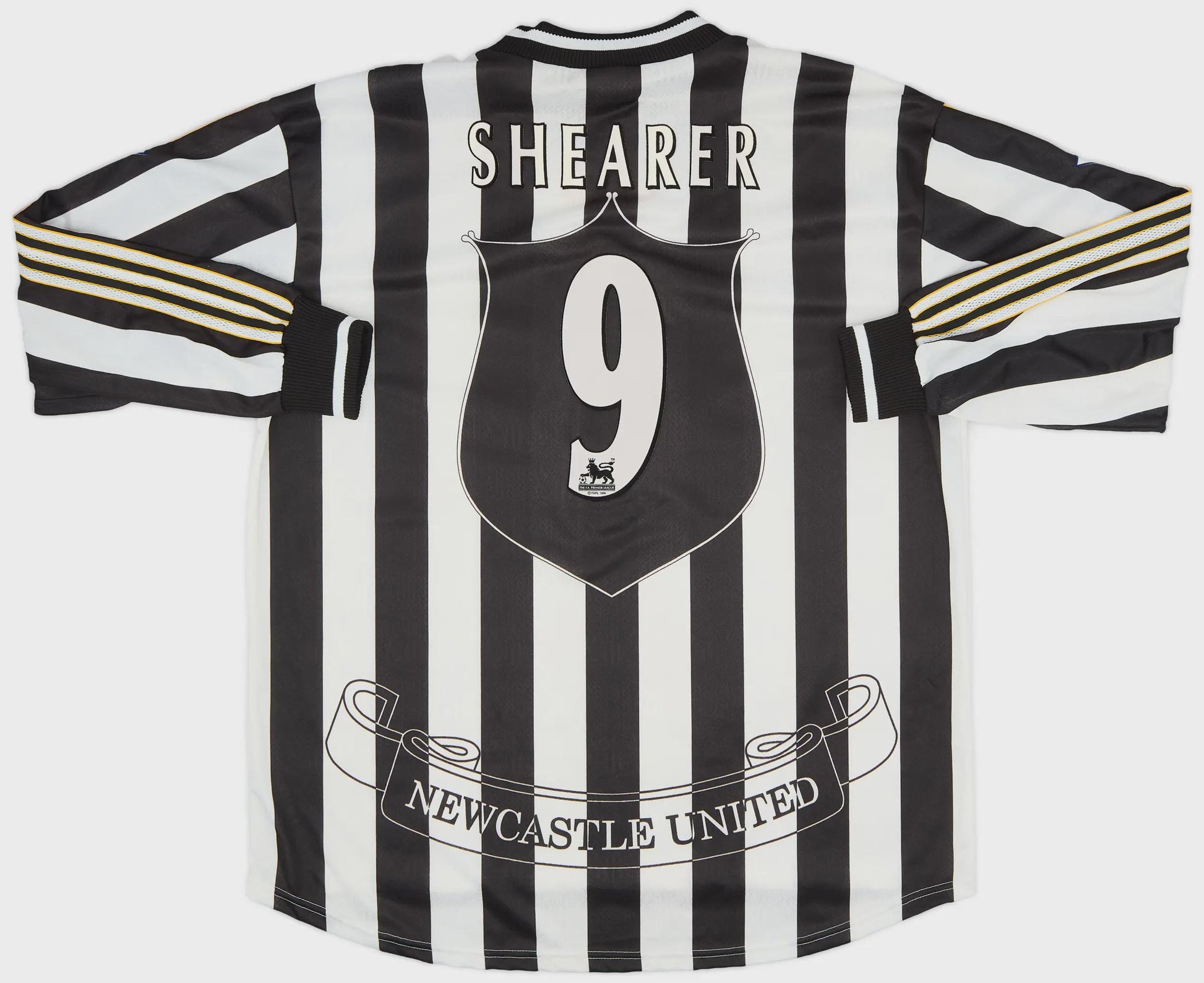 Black and white striped sports jersey with 'Shearer 9' and 'Newcastle United' text on a white background