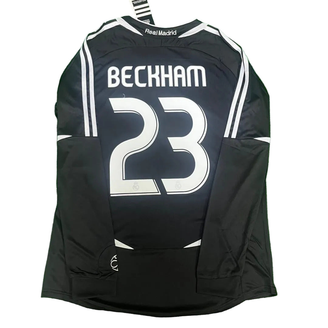 Black soccer jersey with 'Beckham 23' on a green surface