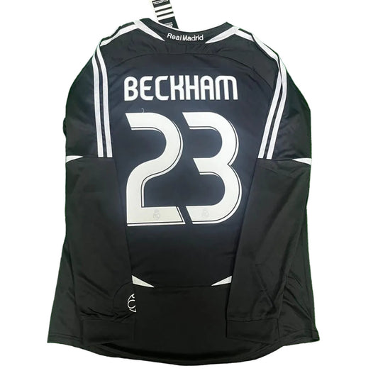Black soccer jersey with 'Beckham 23' on a green surface