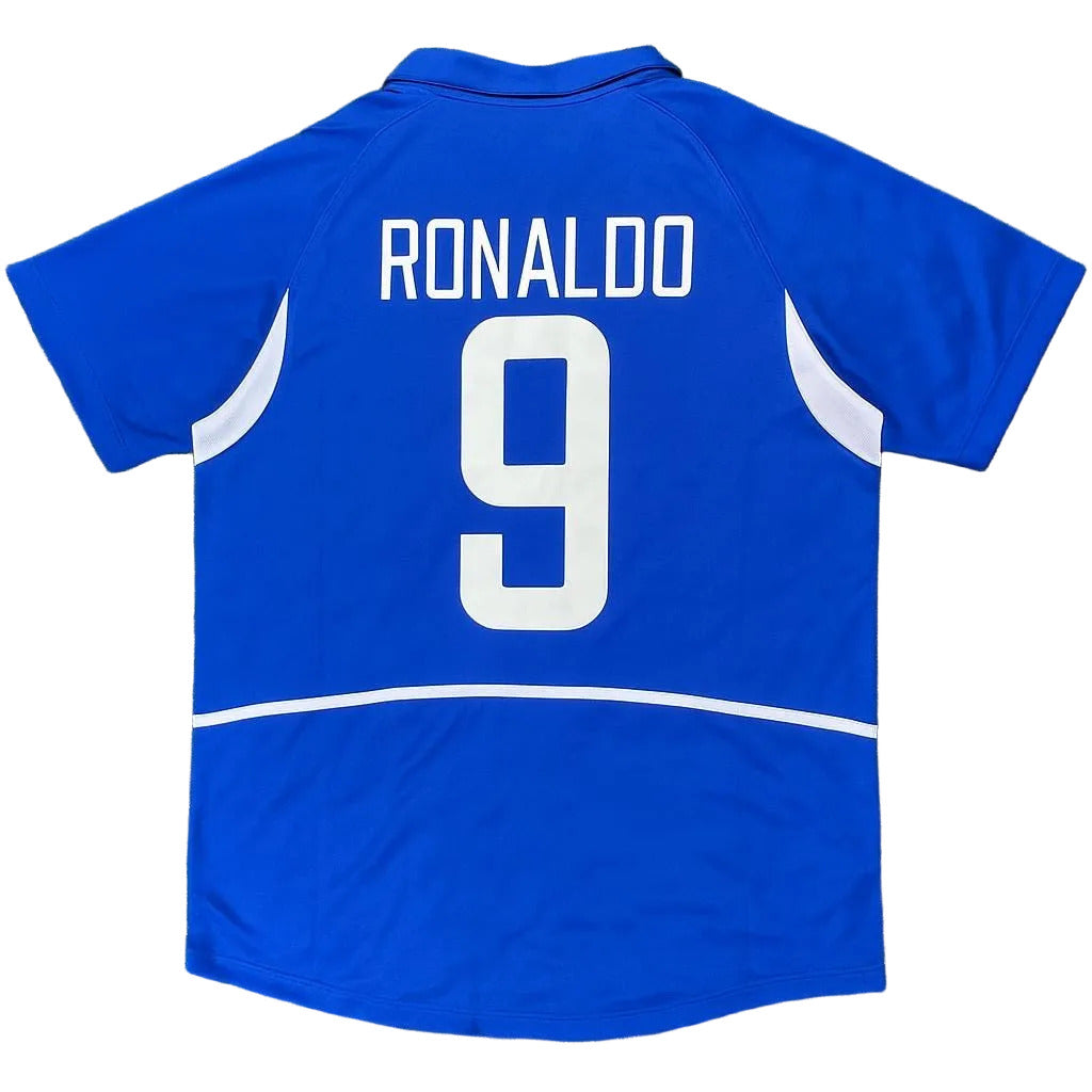 Blue sports jersey with 'RONALDO 9' printed on the back, on a grass background