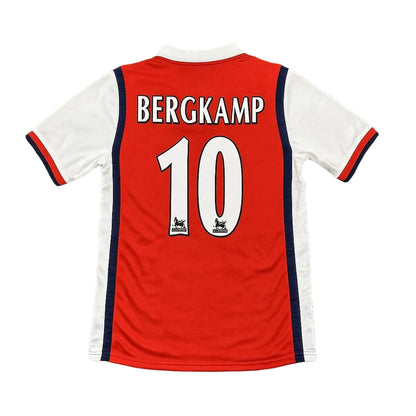 Red and white soccer jersey with 'BERGKAMP' and number '10' on a green grass background