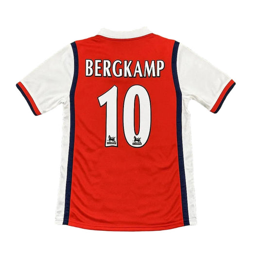 Red and white soccer jersey with 'BERGKAMP' and number '10' on a green grass background