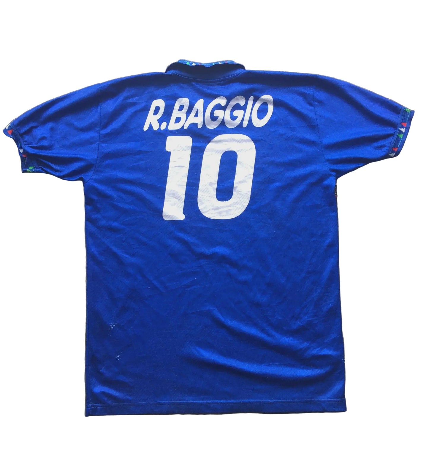 Blue sports jersey with 'R. Baggio' and number '10' on a wooden surface