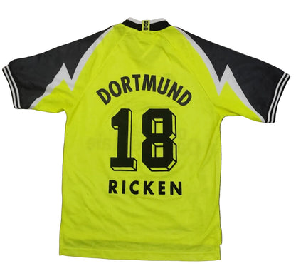 Yellow sports jersey with 'Dortmund 18 Ricken' text on a gray background
