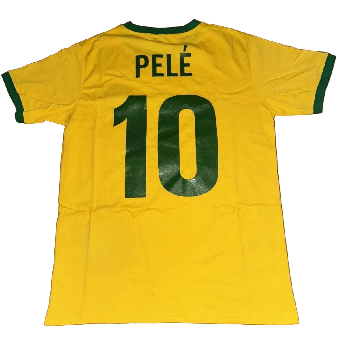 Yellow sports jersey with 'PELE' and number '10' on a brown surface