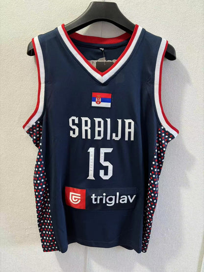 Navy basketball jersey with 'Srbija' and number '15' on a hanger against a light background
